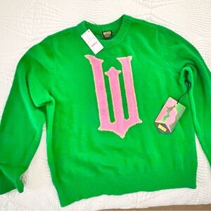 Green Sweater with Pink Logo